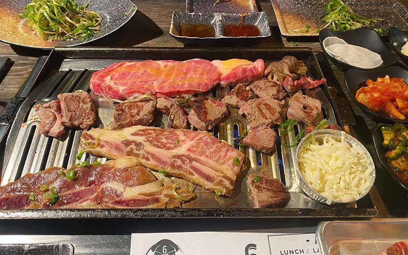 Korean barbecue meats at a restaurant. 