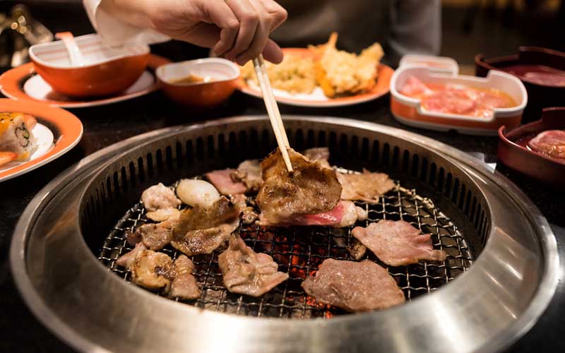 Cooking Korean food at a Korean BBQ restaurant in Las Vegas. 