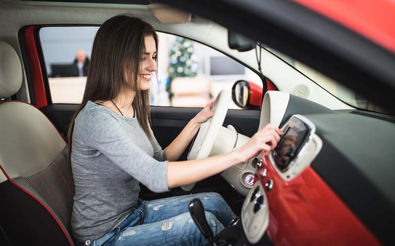 Women listen to a hip hop radio station while driving her car in Las Vegas.