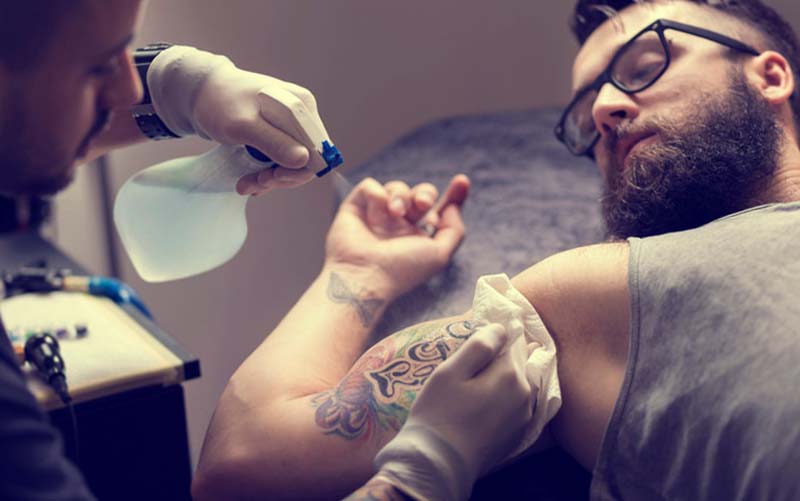Tattoo artist working at a Las Vegas tattoo parlor.