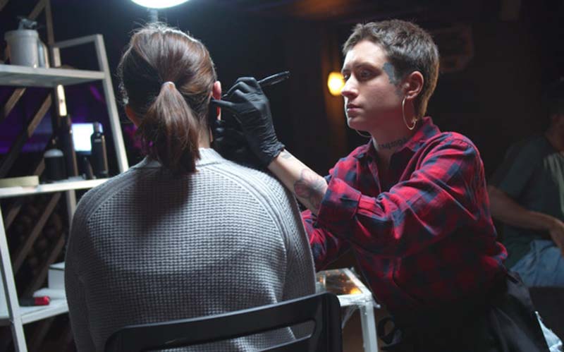 Women getting an ear piercing in Las Vegas.  