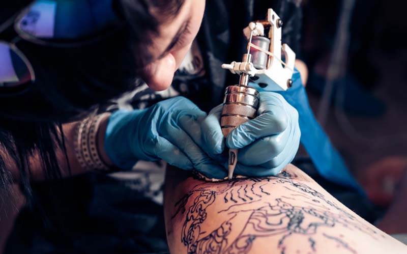 Customer getting a tattoo at one of the tattoo shops Las Vegas. 