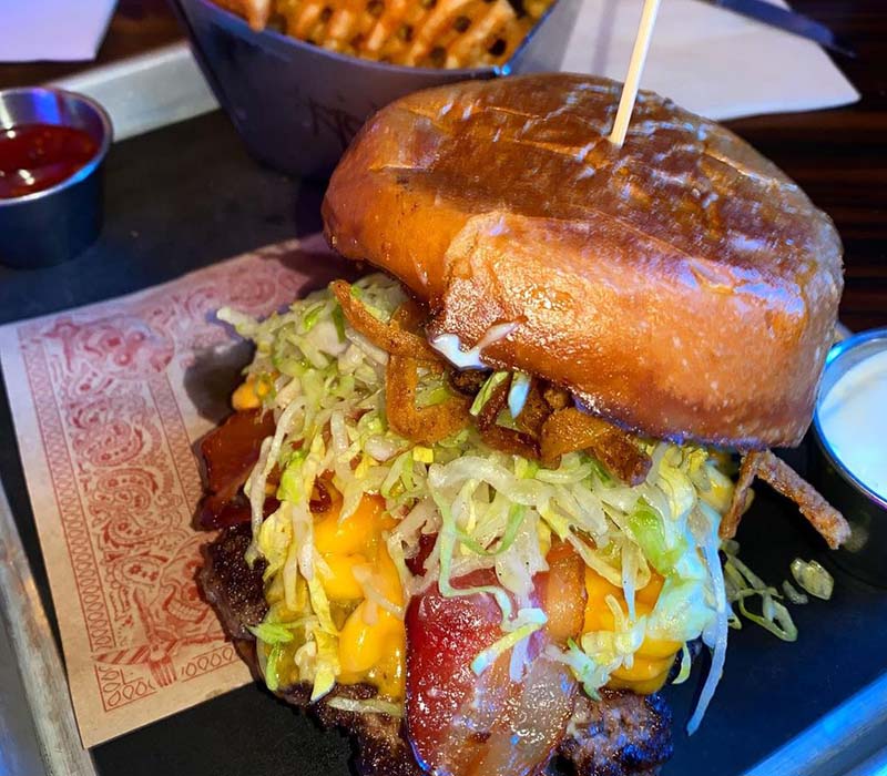 A burger made at Guys Fieri restaurant. 