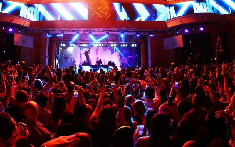 A group of people having a party on a Las Vegas club crawl. 